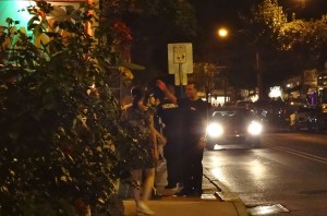 Officer Candice Tremblay assisting apparently distressed female Aug. 23 (Photo: Charlie Sahner)