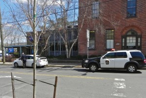 The results of proceeding through a full red signal at Main and Bridge streets with police vehicle waiting for light in opposite lane