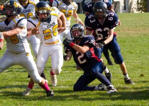 Lions Runningback Tommy Capriotti cuts through the Jenkintown line with the help of lineman Brian Hauch (Photo: Ron Skoroda)