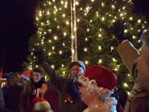 Mayor Larry Keller (center) Dee Fell (right) and George Fernandez (far right) as the tree is finally lit