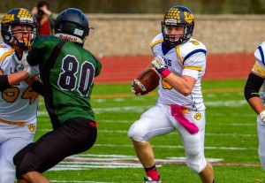 Brendan Shadle runs for his first of two touchdowns Saturday, with Tommy Capriotti helping clear the way