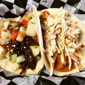 Asian pork taco with Asian pear pico and plum sauce, and Carolina Gold chicken taco with cheddar jack and smoked coleslaw ($3 each).